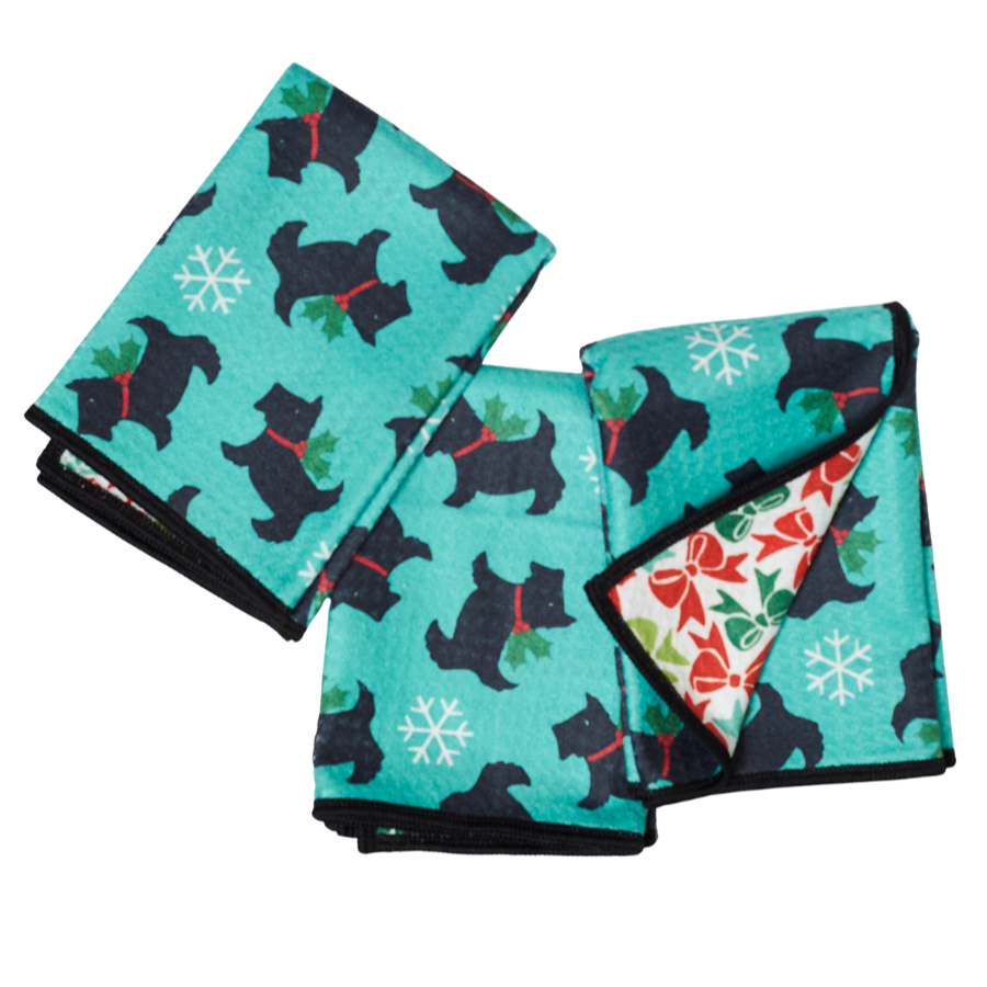 Set of three folded towels with black Scottie dog silhouette pattern on a turquoise background