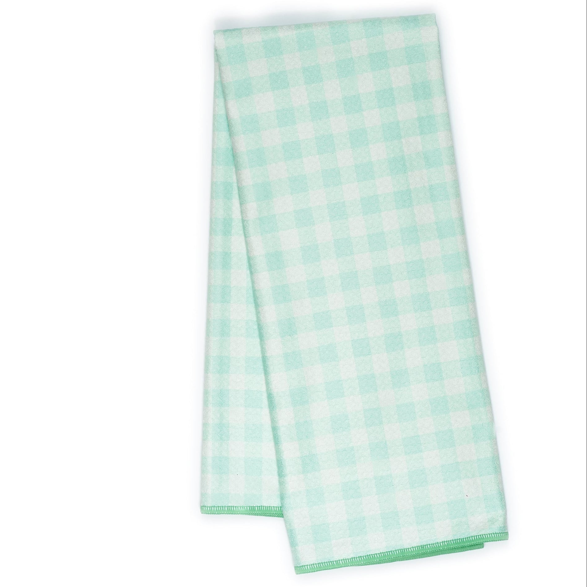 Folded tea towel with green tree pattern 