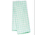 Folded tea towel with green tree pattern 