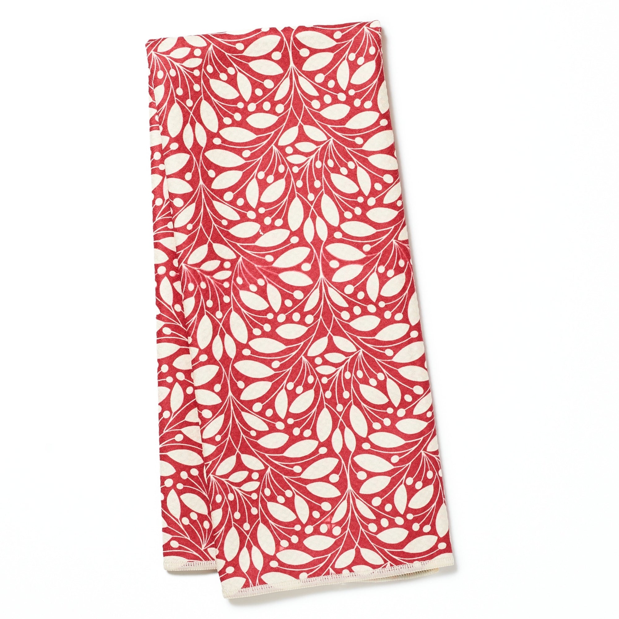 Folded tea towel from Rebecca Jane Woolbright with red and green candy cane on a white background