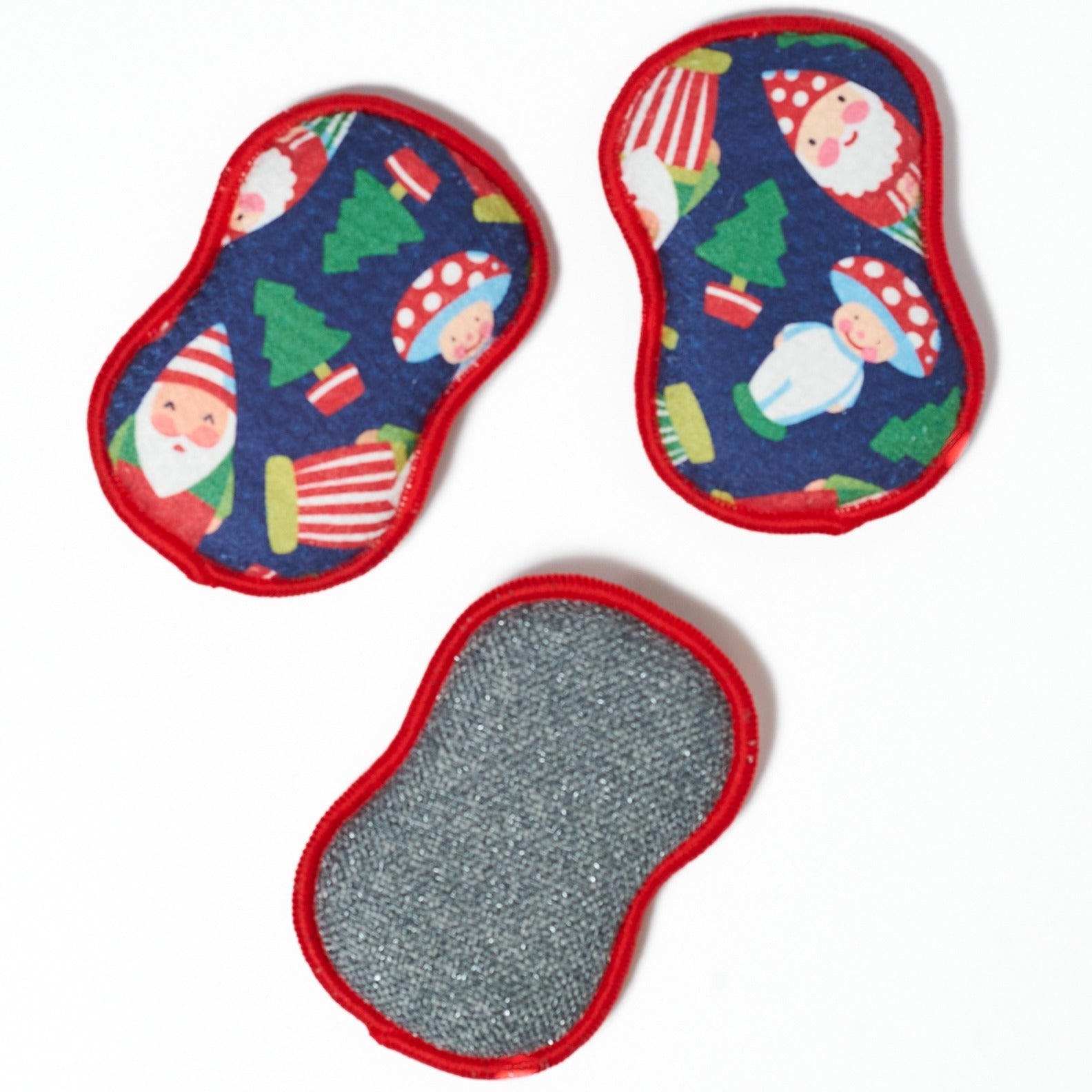 Three colorful Christmas-themed washable sponges with Santa Claus and winter elements on a white background from Mary Engelbreight