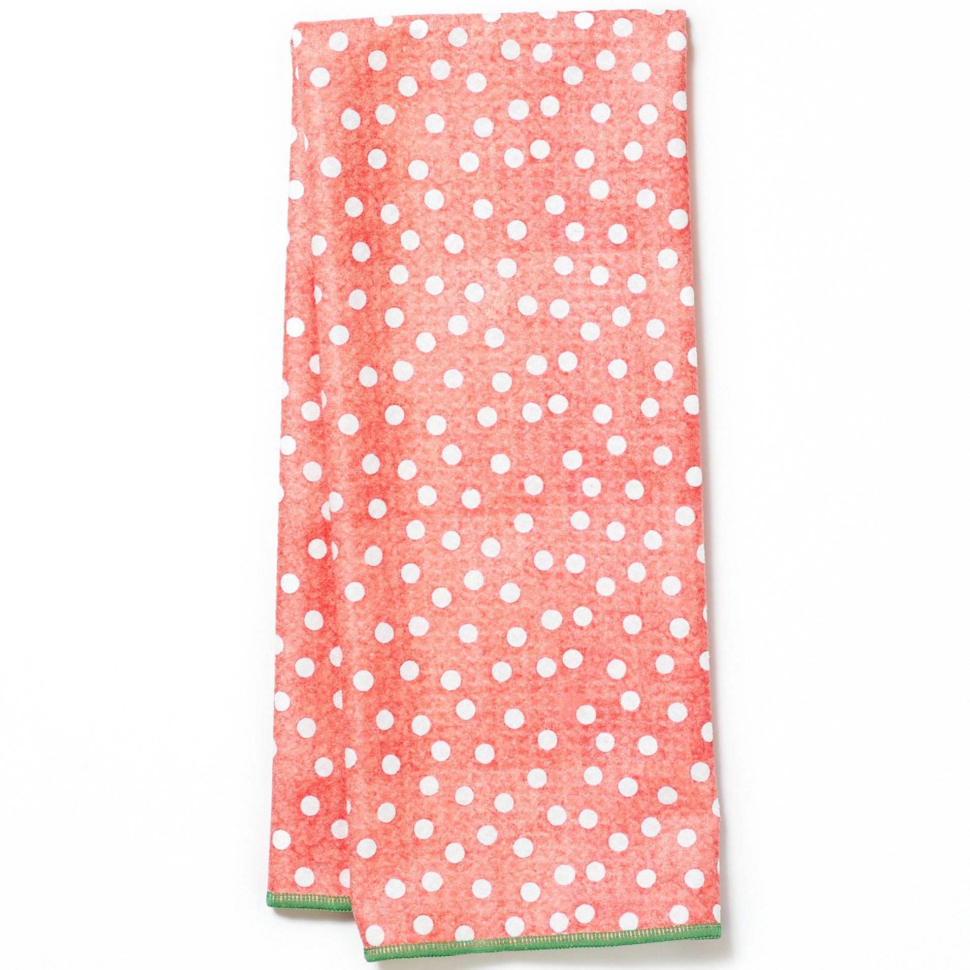 Folded tea towel with holly leaf pattern on a blue background from Mary Engelbreit