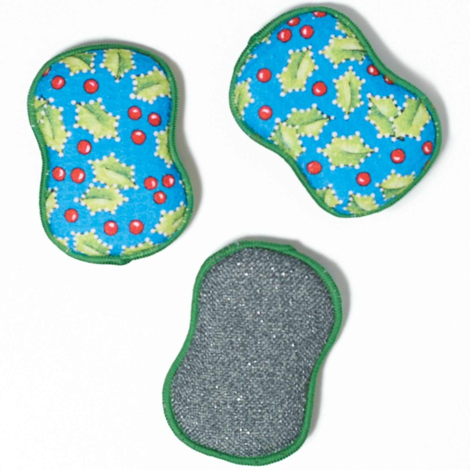 Three washable sponges with holly leaf and berry pattern on a white background from Mary Engelbreit