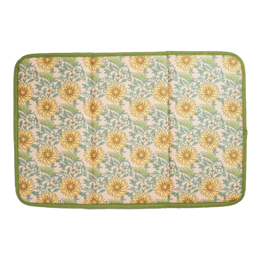 Floral patterned drying mat with yellow flowers on a green border