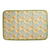 Floral patterned drying mat with yellow flowers on a green border