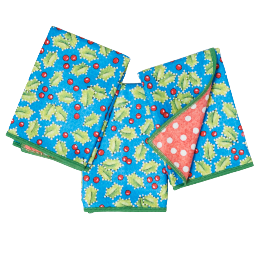 Set of three colorful napkins with holly leaf pattern on a white background from Mary Engelbreit