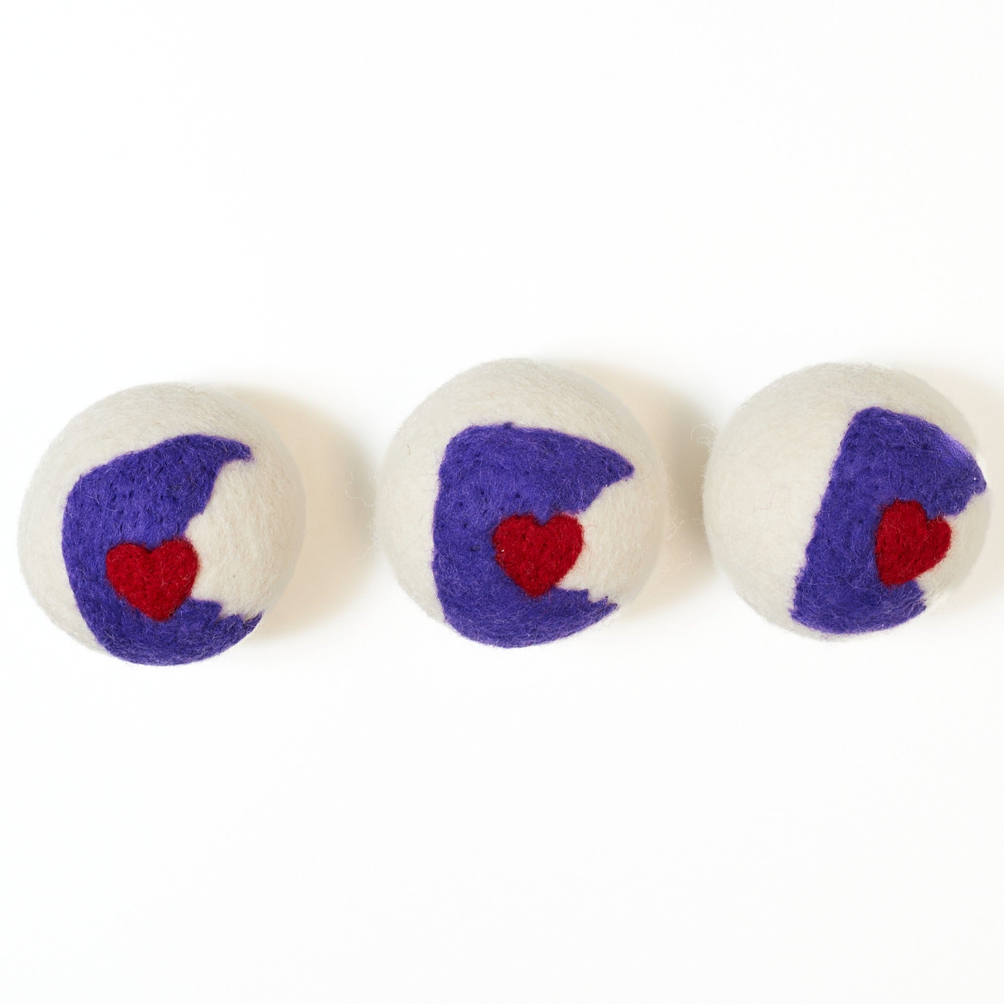 Three felted dryer balls with Minnesota state on them