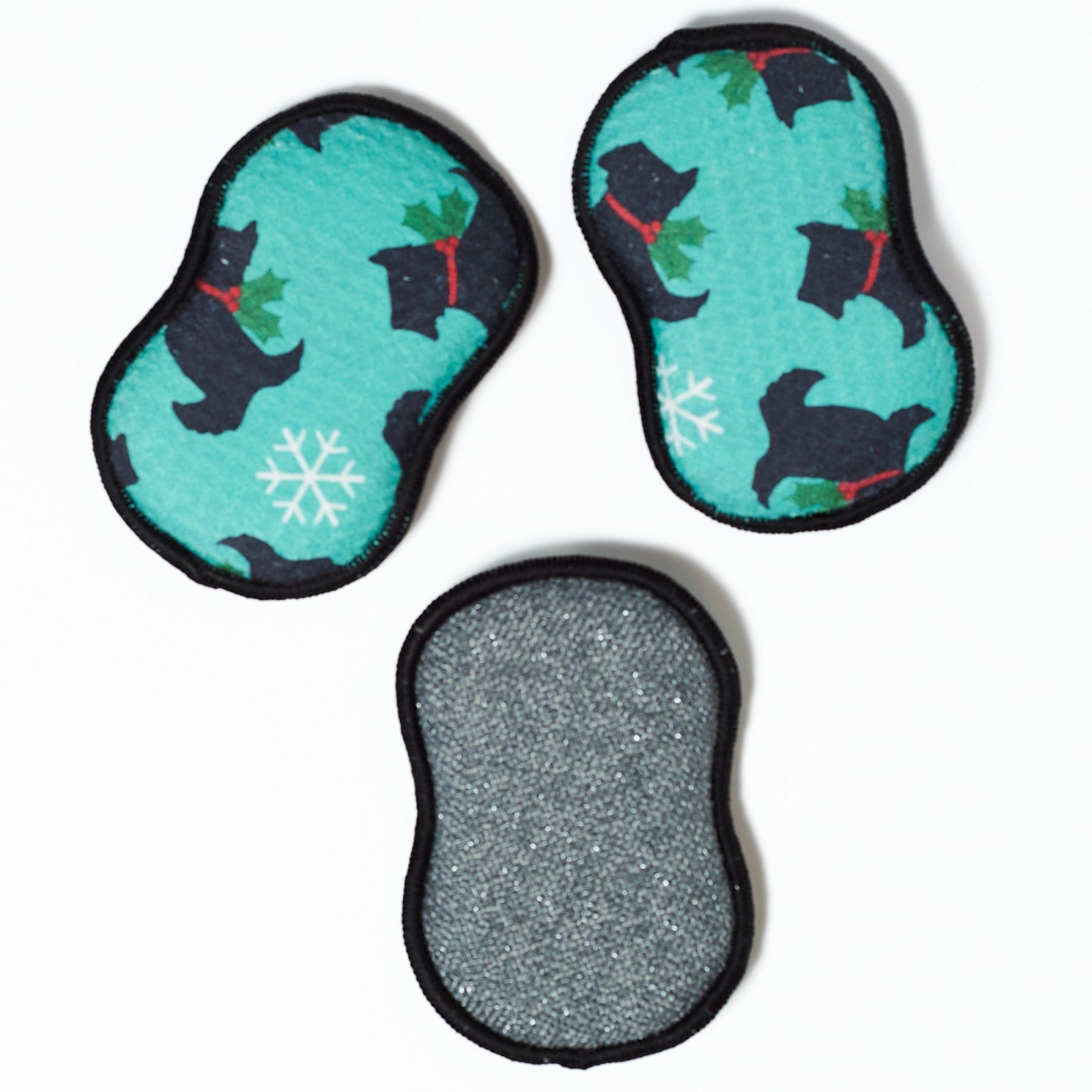 Three teal washable sponges with black dog illustrations on a white background from Mary Engelbreit