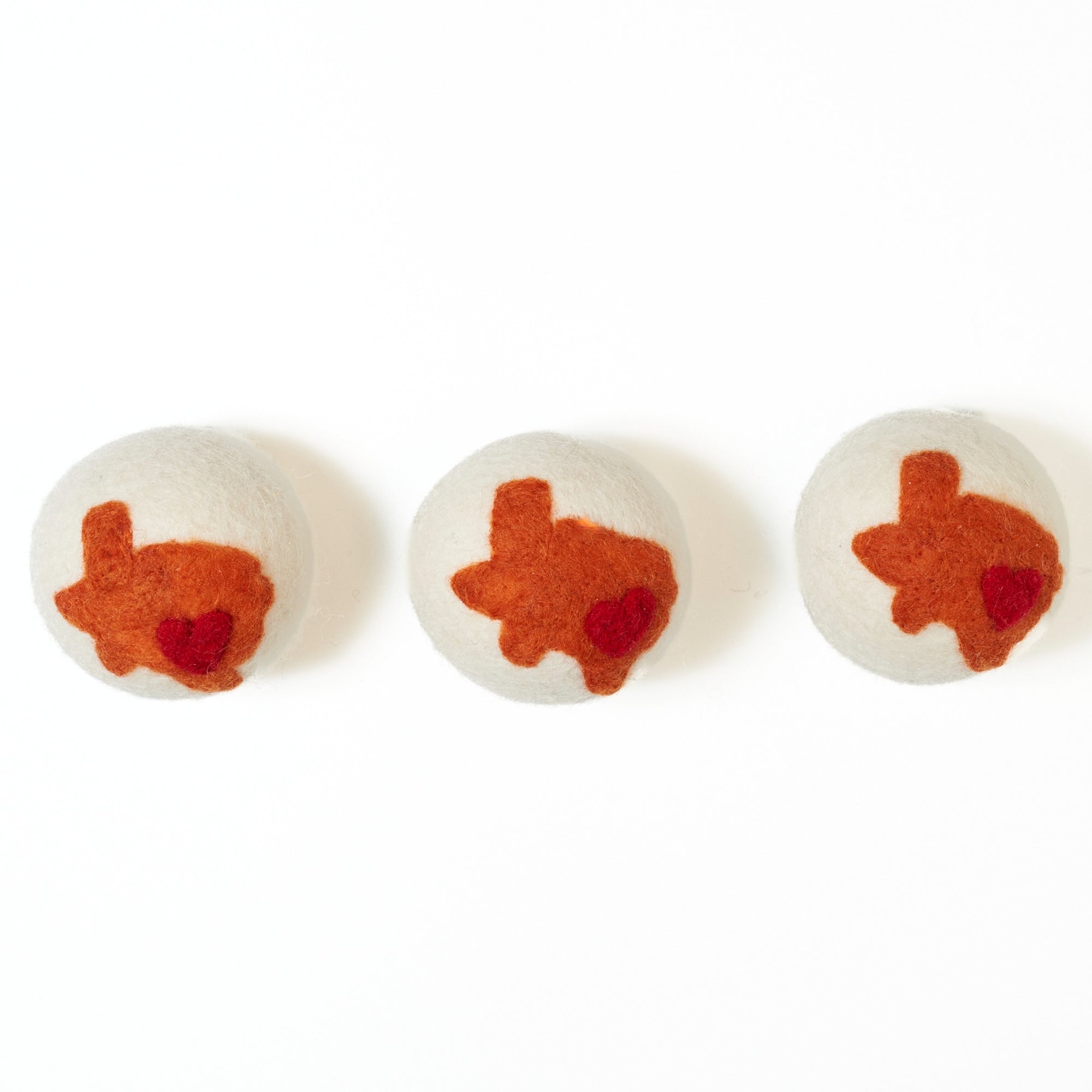 Three dryer balls with the state of Texas 