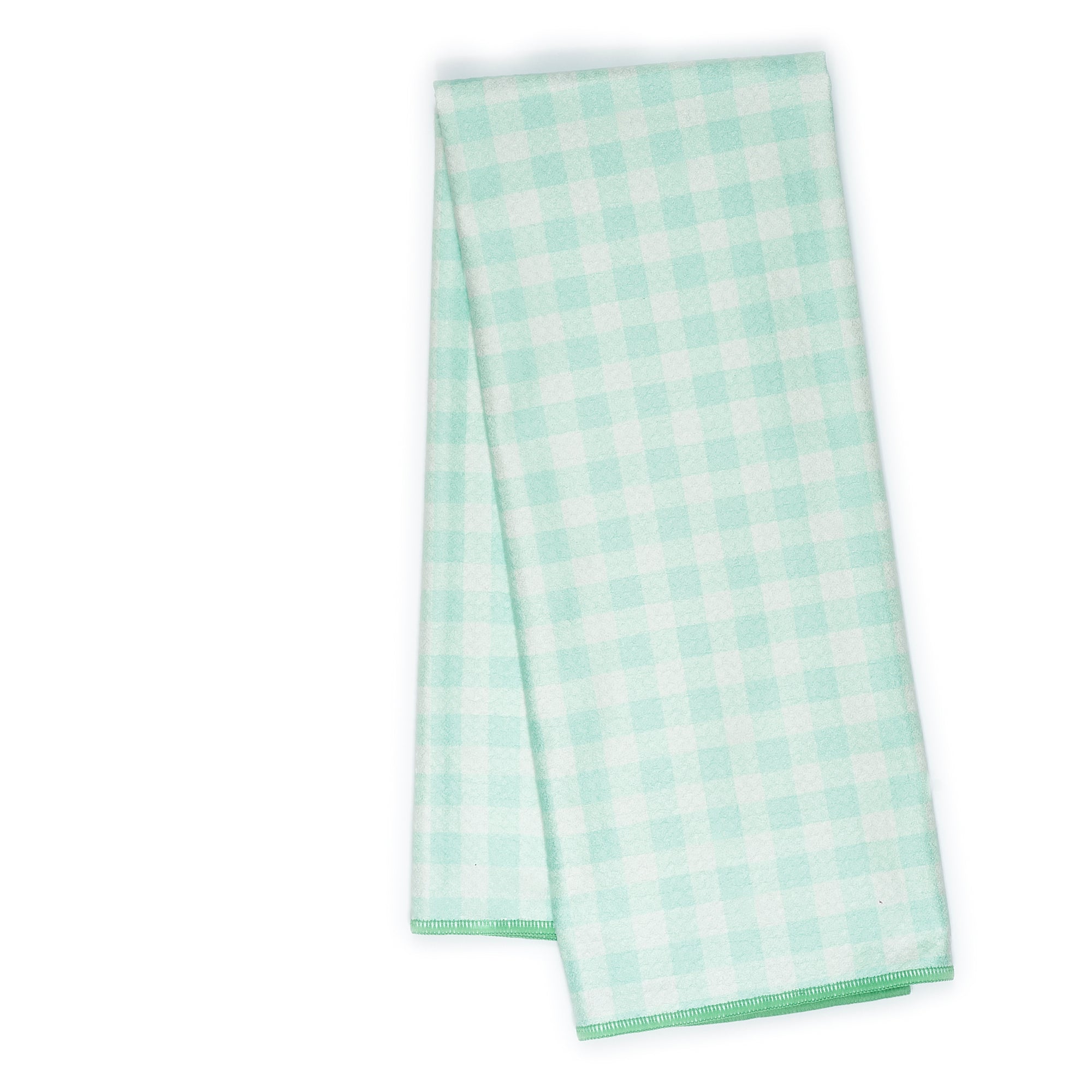 Folded tea towel with green tree pattern 