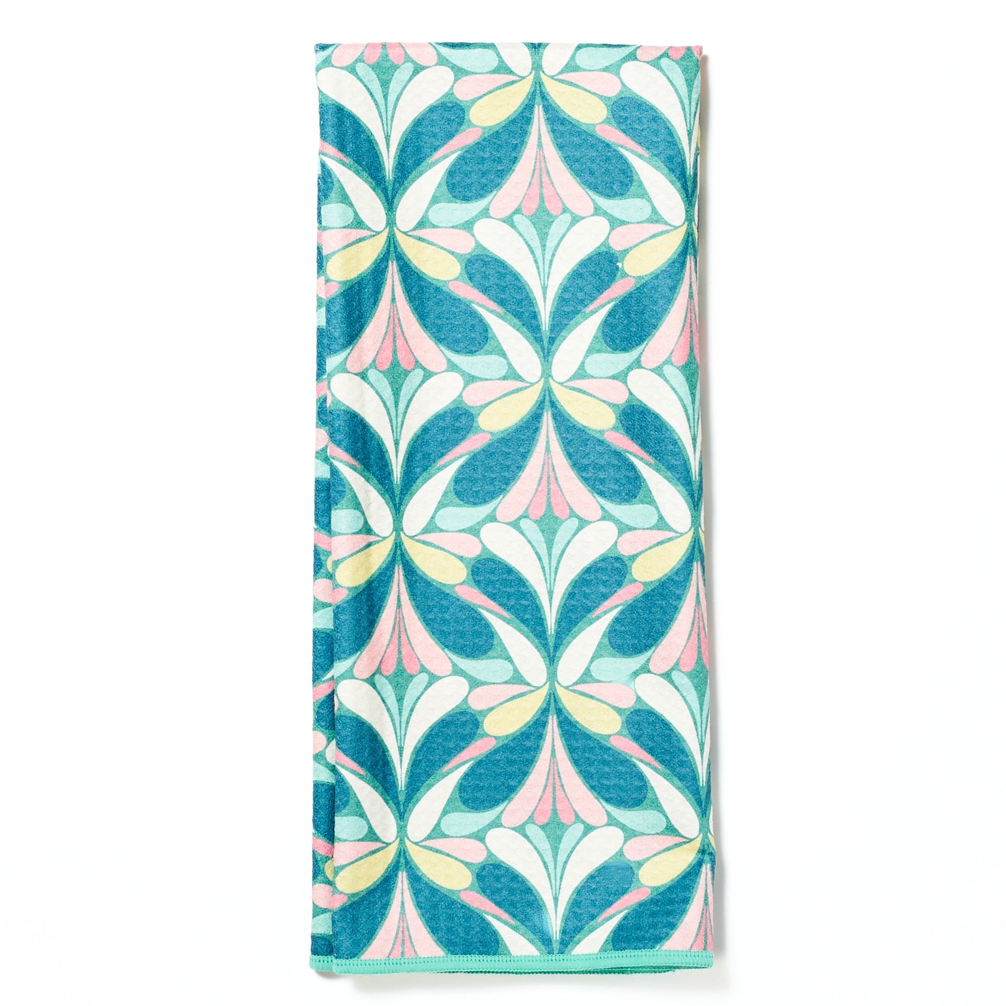 Folded tea towel from Rebecca Jane Woolbright with wreath and bow pattern on a white background