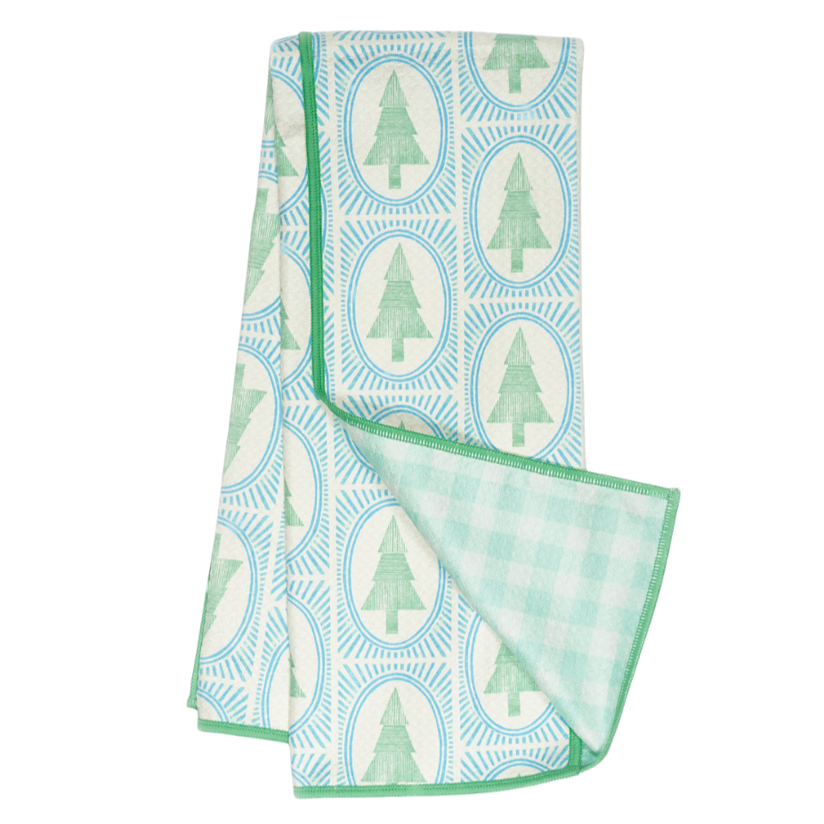 Folded tea towel with green tree pattern 